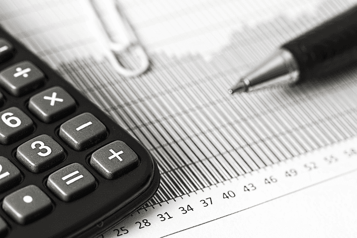 Financial documents and a calculator representing comparison of providers and mortgage serviceability with the Quashed 2026 Market Scan