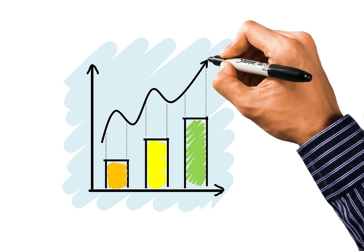 A hand drawing a rising bar graph with yellow and green bars, illustrating the 10–30% annual premium increases for Southern Cross Health insurance in 2026, featured by Quashed.