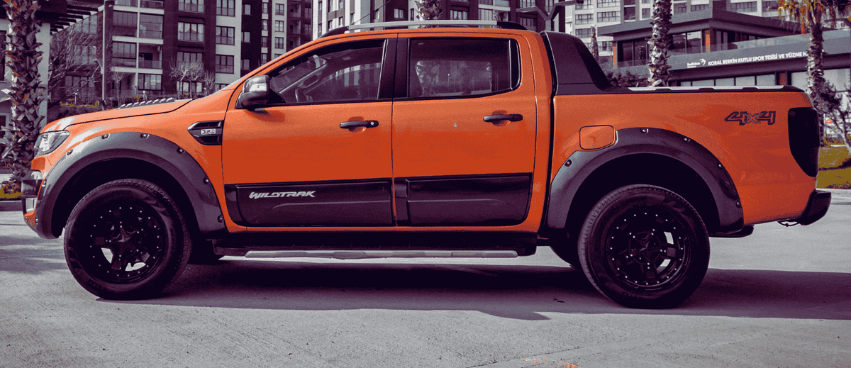An orange and black Ford Ranger.