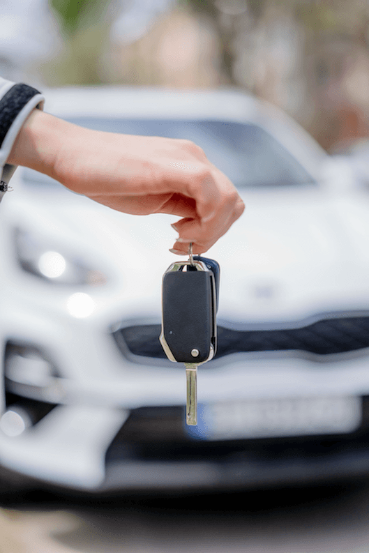 A Trade Me Motors sale showing keys being held before car entry, representing a kiwi considering the difference between asking prices and true market value that Quashed explains to help Kiwis set their insurance sum insured correctly in 2026.