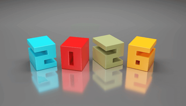 The number 2026 formed with colourful blocks on a desk, representing the key market changes affecting Tower Insurance car insurance customers in 2026, as explained by Quashed.