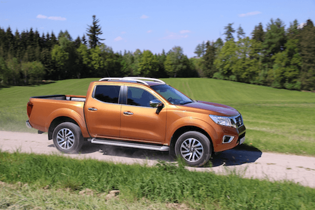 A modern bronze ute driving on a gravel road, highlighting FMG’s 2026 car insurance options and comprehensive cover for Kiwi drivers.