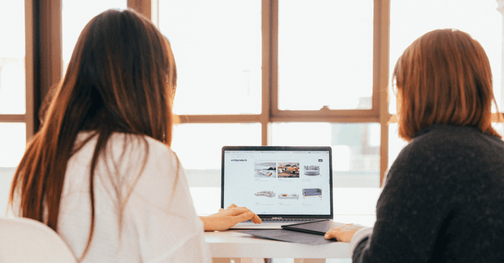 Two women on a laptop.