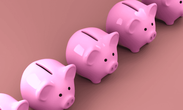 Five pink piggy banks in a row.