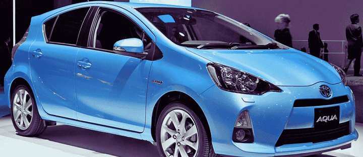 A blue Toyota Aqua.