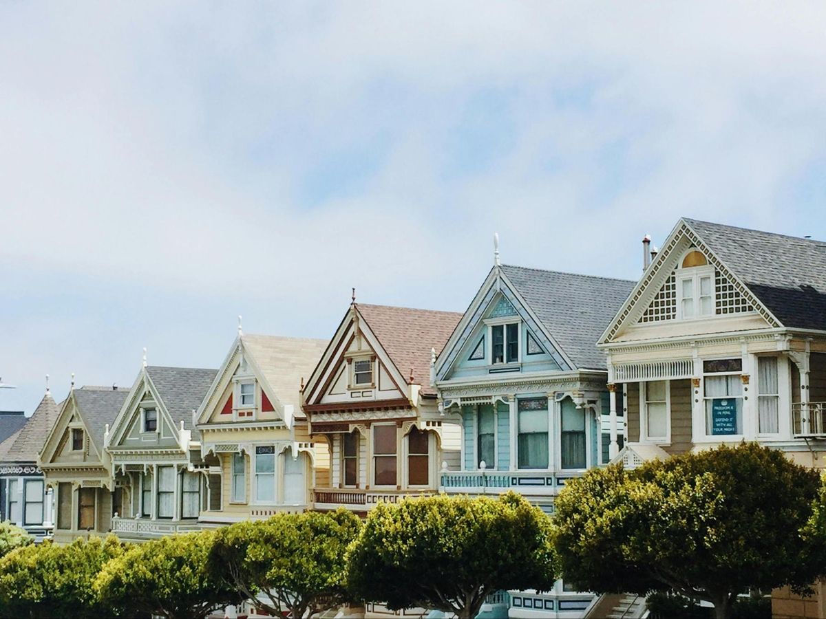 A row of residential houses illustrating the 2026 guide to finding the cheapest and best house insurance in NZ by Quashed.