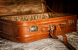 Luggage being packed by a kiwi before driving to Auckland Airport, representing the importance of checking car insurance cover before leaving a vehicle in airport parking in 2026.