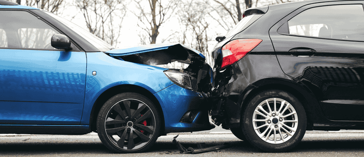Two cars with visible crash damage.