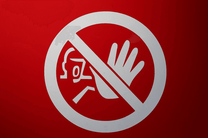 A warning sign, representing the common valuation mistakes that Quashed helps New Zealand car owners avoid when comparing Trade Me prices and insurance payouts in 2026.